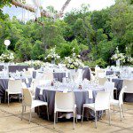 Outdoor reception tables set under trees at Moholoholo Ya Mati, one of the most scenic wedding venues in Hoedspruit.