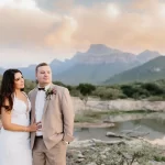 Couple with a mountain view at Moholoholo Ya Mati, a unique bush wedding venue in Limpopo with photo-perfect backdrops.