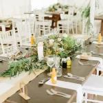 Eco-inspired wedding table décor with fynbos and wooden elements at Moholoholo Ya Mati, an affordable wedding venue near Hoedspruit.